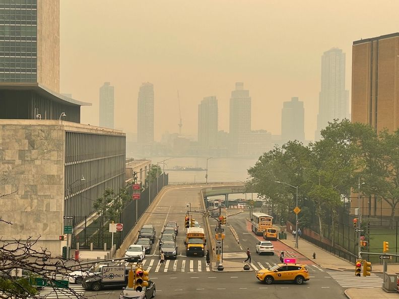 Traffic in New York City under a haze of wildfire smoke